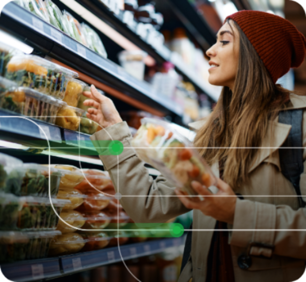 A women in a grocery store buying fresh produce and checking the labels